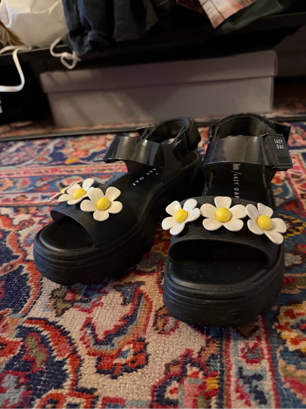 Black Lazy Oaf x Melissa sandals with daisy details